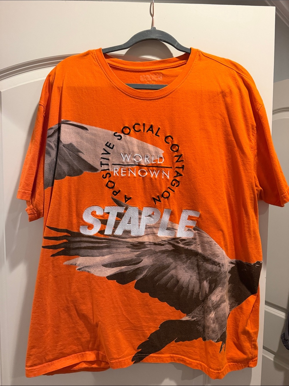 Staple Orange Graphic Tee with Bird Motif